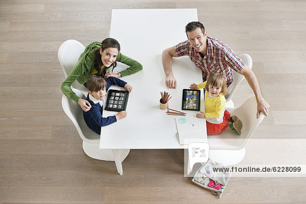 High angle view of couple teaching their children