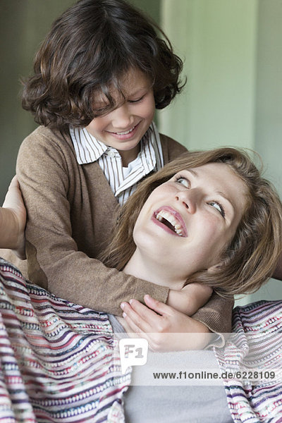 Close-up of a woman with his son smiling