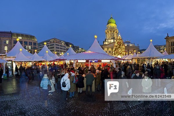 Traditional Christmas Market at Gendarmenmarkt illuminated at dusk  Berlin  Germany  Europe