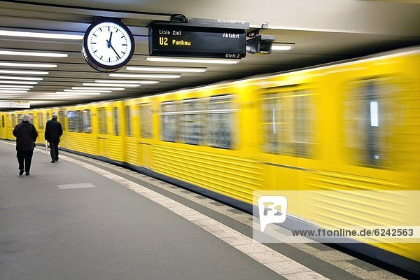 Moving train pulling into modern subway station  Berlin  Germany  Europe