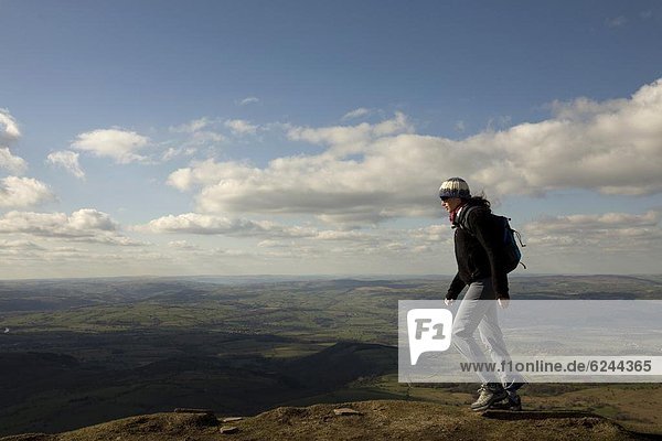 A hiker walks north from Hay Bluff  above Hay-on-Wye  Brecon Beacons National Park  Herefordshire  England  United Kingdom