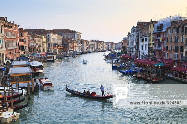 A gondola crossing the Grand Canal  Venice  UNESCO World Heritage Site  Veneto  Italy  Europe