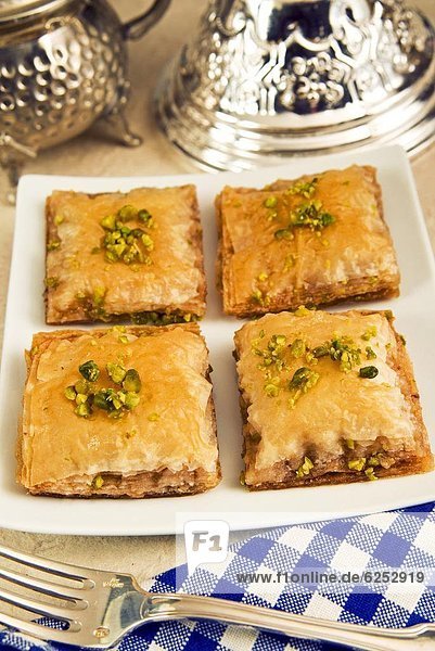 Baklava  sweet pastry made of layers of filo pastry filled with chopped nuts and sweetened with syrup or honey  Arabic gastronomy  Middle East