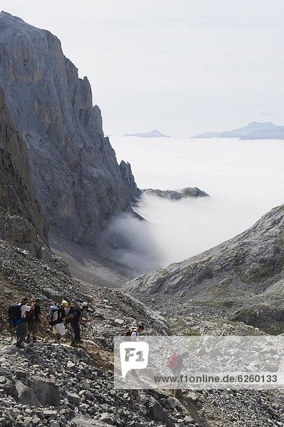 Hikers in the Picos de Europa 0tio0l Park  shared by the provinces of Asturias  Cantabria and Leon  Spain  Europe