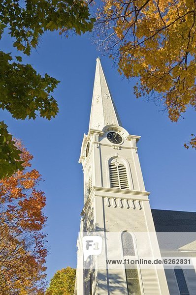 Autumn fall colours around traditio0l white timber clad church  Manchester  Vermont  New England  United States of America  North America