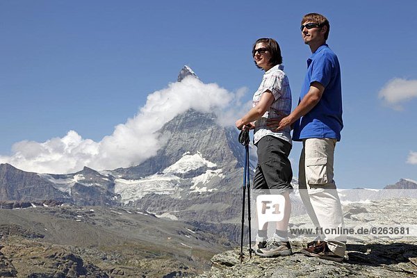 Hikers in front of the Matterhorn  Riffelberg  Zermatt  Valais  Swiss Alps  Switzerland  Europe