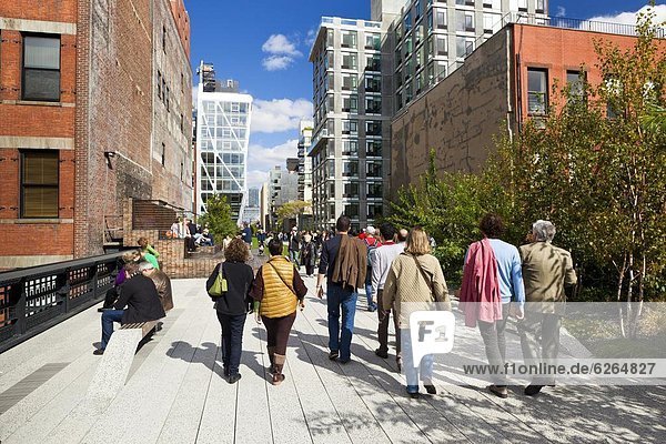 People walking on the High Line  a one-mile New York City park  New York  United States of America  North America