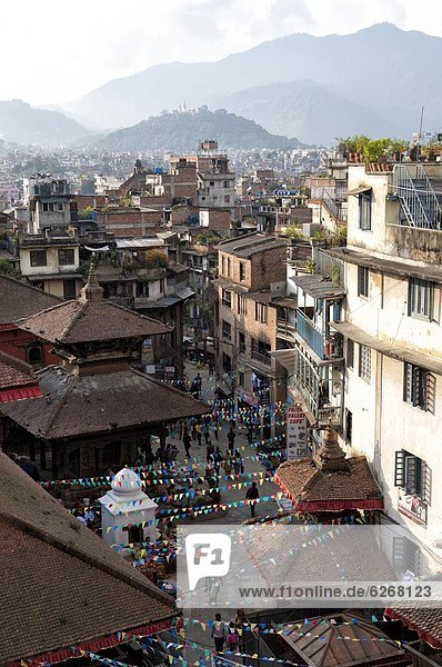 View over narrow streets and rooftops near Durbar Square towards the hilltop temple of Swayambhunath  Kathmandu  Nepal  Asia