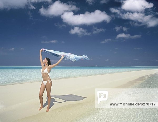 Girl on beach  Rhiveli  Maldives  Indian Ocean  Asia