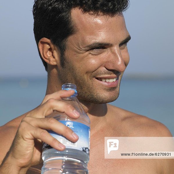 Man holding water bottle  close-up