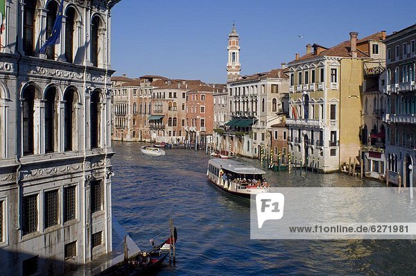 A view of the Grand Canal from the Rialto Bridge with Palazzo Camerlengha on the left and Chiesa dei SS Apostoli  Venice  UNESCO World Heritage Site  Veneto  Italy  Europe