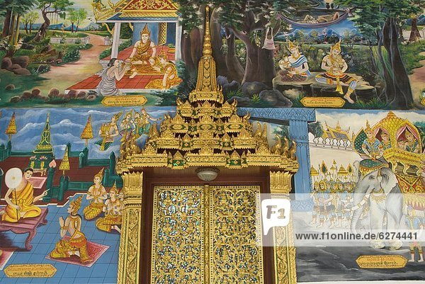 Decorative door and wall paintings  Wat Impeng  Vientiane  Laos  Indochina  Southeast Asia  Asia