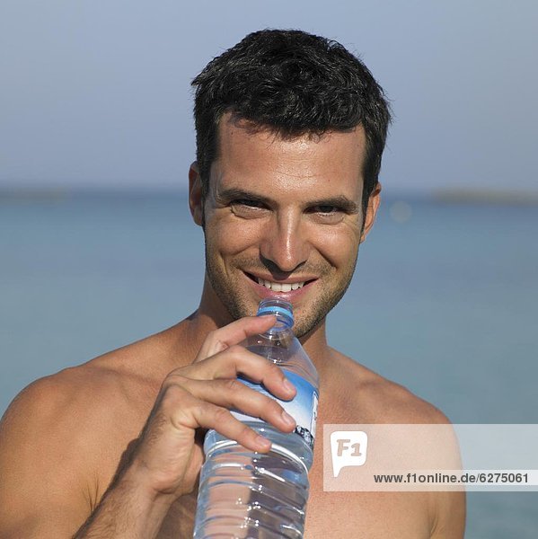 Man holding water bottle  close-up