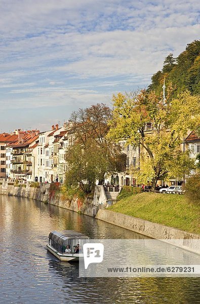River cruise boat on the Ljubljanica River in autumn  Ljubljana  Slovenia  Europe