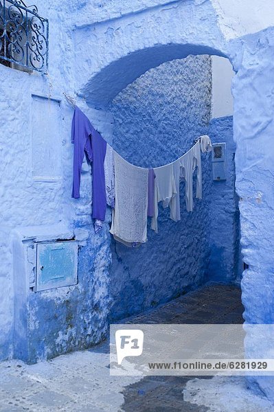 Clothes drying in a typical house entrance  Chefchaouen  Morocco  North Africa  Africa