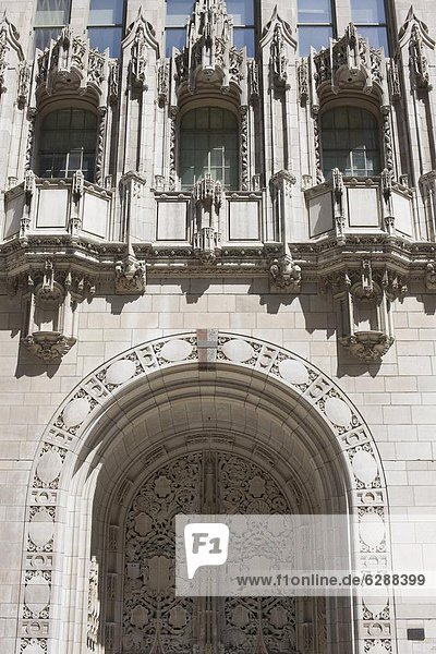 Ornate Gothic style entrance to the Tribune Tower  Chicago  Illinois  United States of America  North America