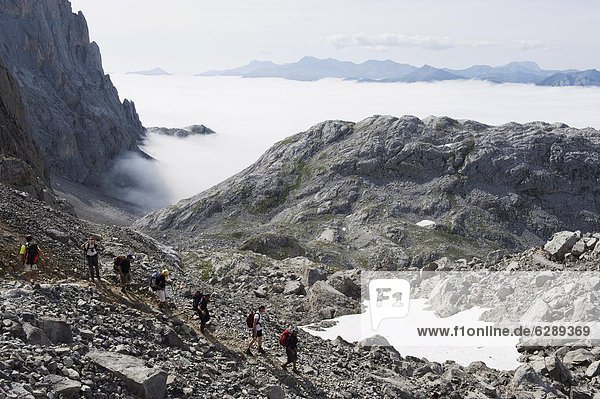 Hikers in the Picos de Europa National Park  shared by the provinces of Asturias  Cantabria and Leon  Spain  Europe