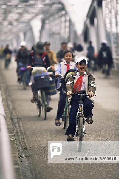Children on bicycles  Hue  Vietnam  Indochina  Southeast Asia  Asia