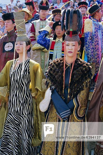 People in traditional costumes at the tournament  Naadam Festival  Ulaan Baatar (Ulan Bator)  Mongolia  Asia