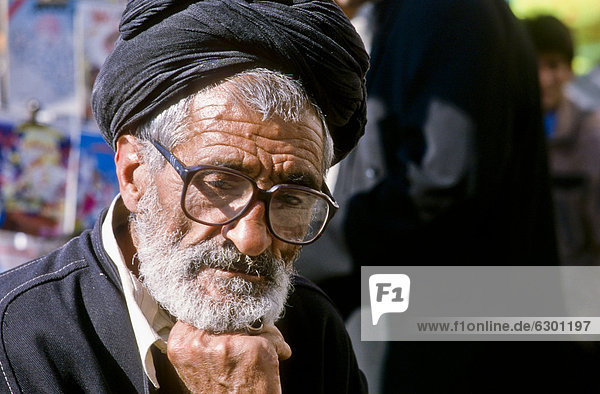 Man with glasses  pensive  bazar of Shiraz  Iran  Western Asia