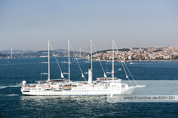 'Sailing cruise ship ''Wind Star'' of Windstar Cruises  Bosphorus Bridge at back  Istanbul  Turkey'