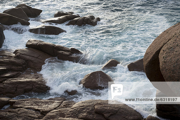 Surf with rocks in the evening light  CÙte de Granit Rose  Brittany  France  Europe