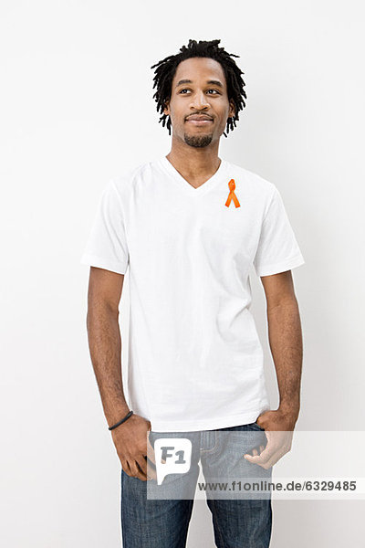 Man wearing orange awareness ribbon