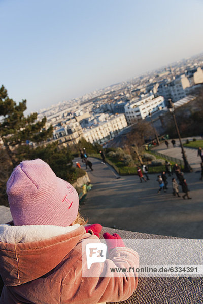 Little girl looking at view of city  Montmartre  Paris  France