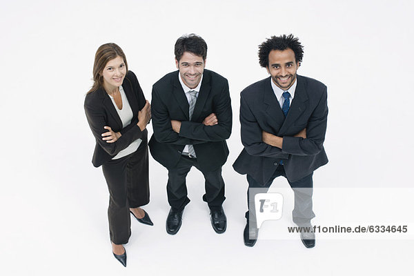 Executives standing together with arms folded  portrait
