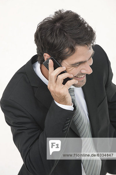 Businessman talking on cell phone  elevated view