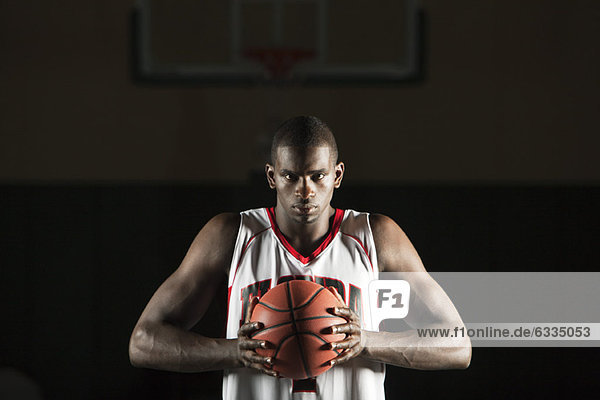 Basketball player preparing to shoot basket