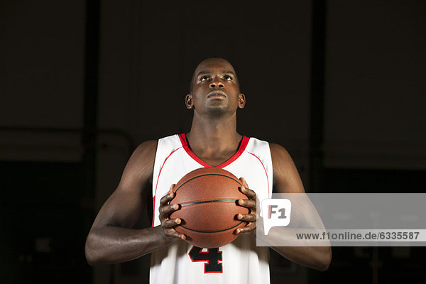 Basketball player preparing to shoot basketball  portrait
