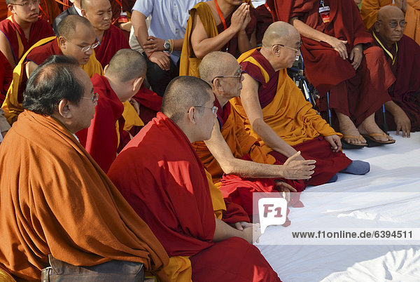 The Dalai Llama and other high Buddhist dignitaries and scholars as the Karmapa  Sogyal Rinpoche meet for common prayer with Buddhists from all over the world  Global Buddhist Congregation  2011  at Gandhi Smitri  New Delhi  India  Asia