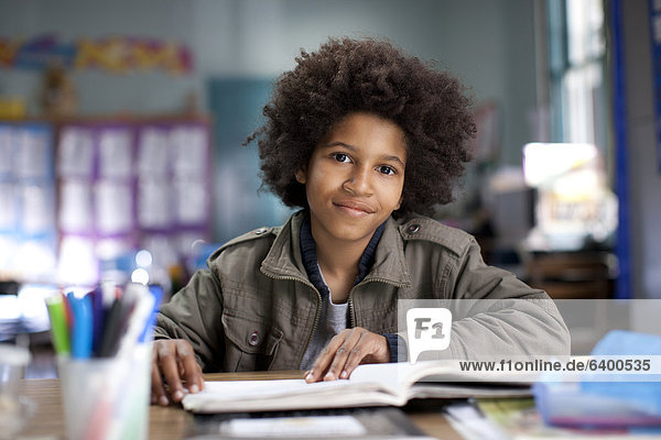 African American boy studying in classroom