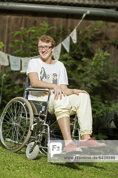 Teenager sitting in a wheelchair
