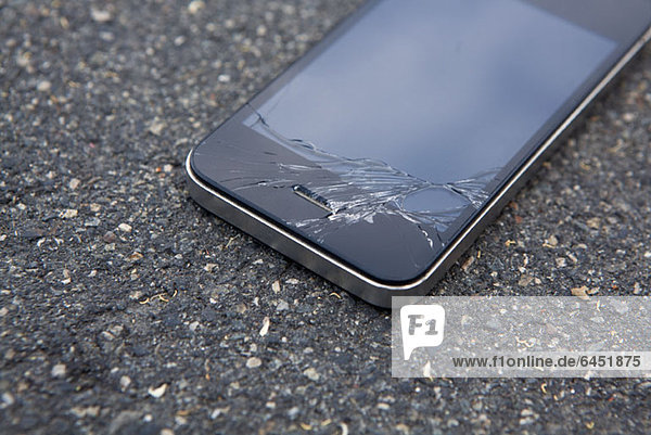 Detail of a smart phone with a cracked screen