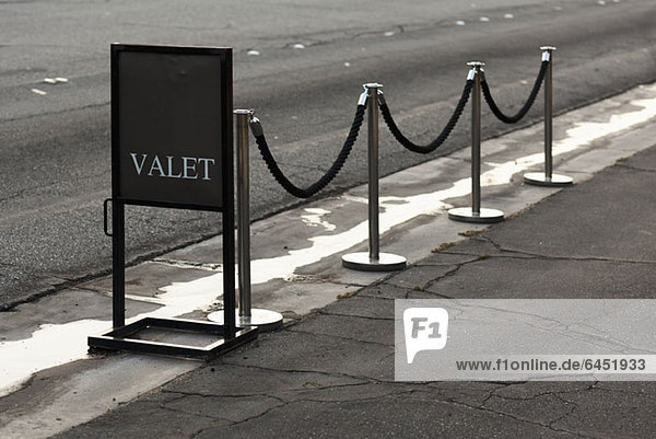 Sign and stanchions for valet parking
