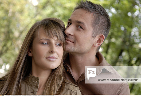1243742 outdoor day summer people couple woman man young 20-25 girl brunette long haired dark haired 30-35 mature smile smiling blouse beige jacket blouses portrait close up horizontal