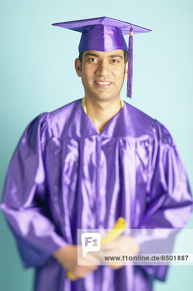 Portrait of man in cap and gown