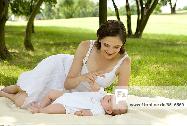Mother with a baby in the park.