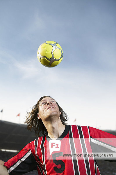 Soccer player headering the ball