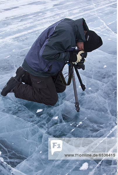 Mandatory Credit: Photo by Michael S. Nolan / SpecialistStock / Rex Features ( 1277577a ) Canadian photographer Gilles Pucheu at work near his home in Yellowknife Northwest Territories Canada. MORE INFO Model release number GP032810. VARIOUS