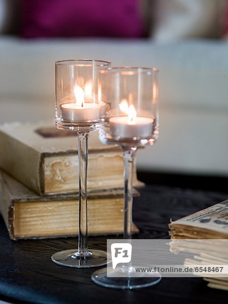 Close up of glass with tea lights on table