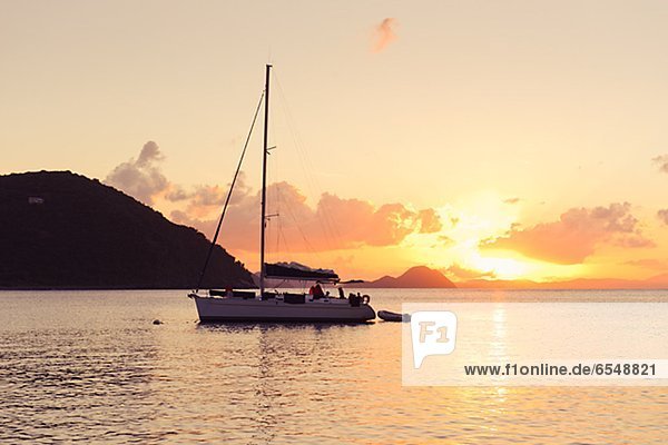 Sailing boat against sunset