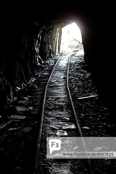 dark tunnel in slate quarry in wales