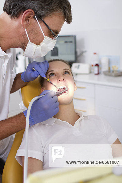 Germany  Brandenburg  Strausberg  Dentist examining patients teeth