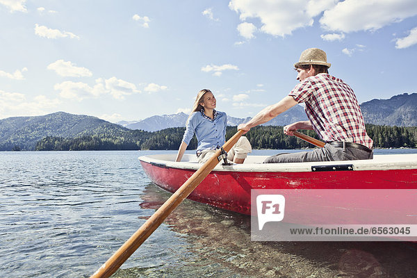 Germany  Bavaria  Couple in rowing boat  smiling