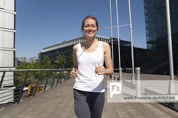 Young woman Jogging  smiling  portrait