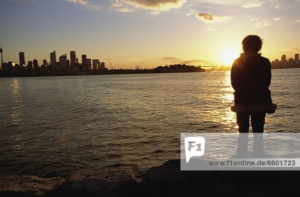 Woman Watching Sunset In Sydney Harbor