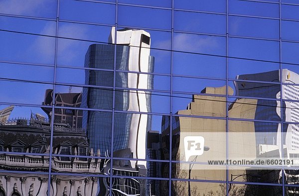 Skyscrapers Reflected In Modern Glass Building